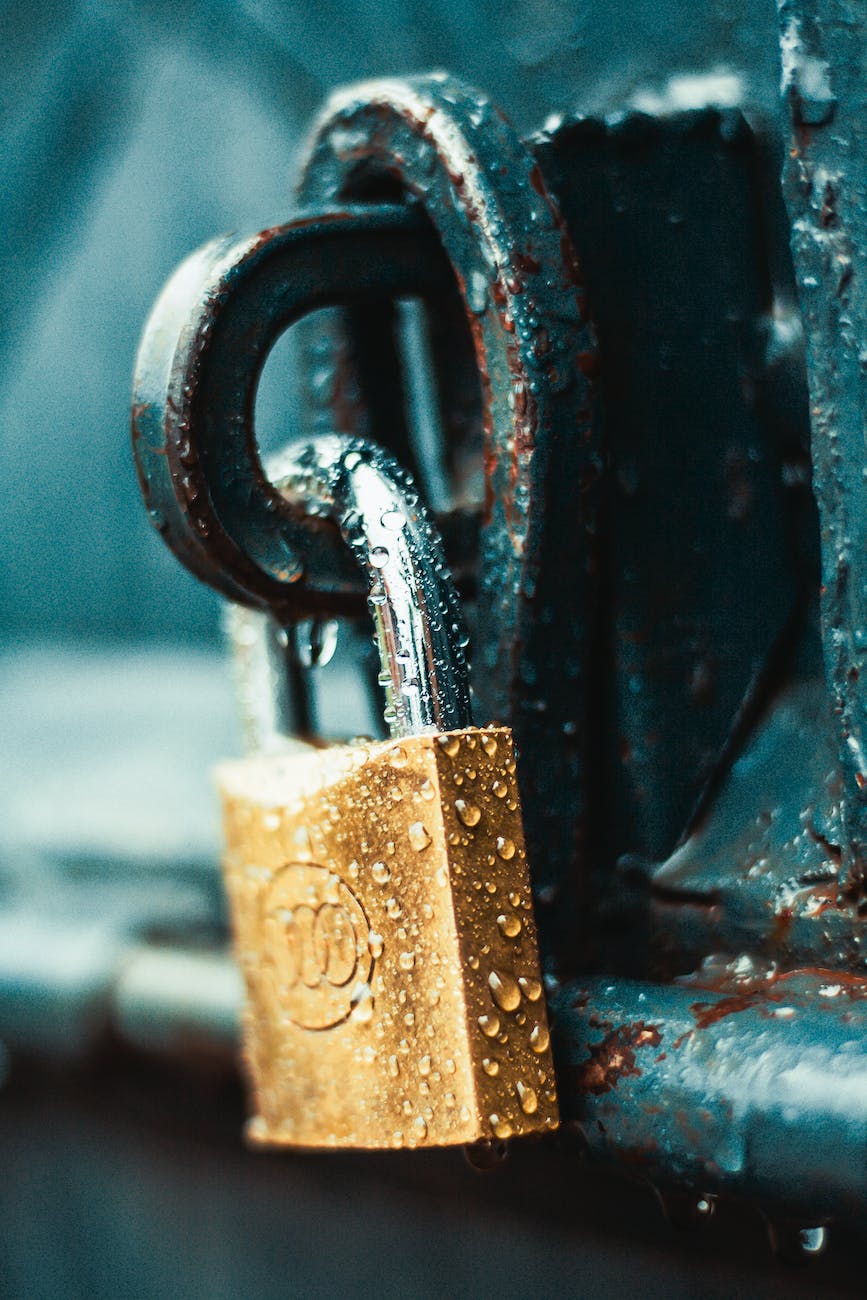 close up photography of wet padlock